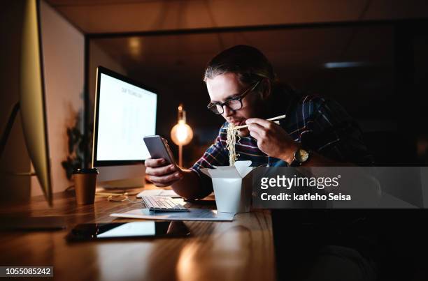 trying to fill up and do work - noodles eating stock pictures, royalty-free photos & images