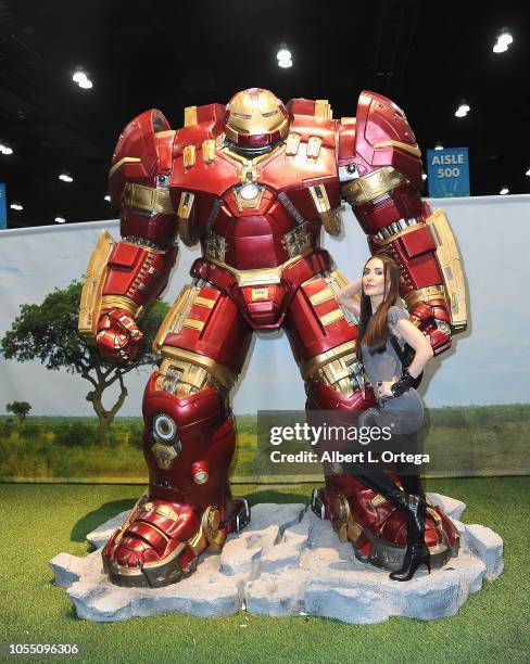 Actress Mandy Amano poses with the Hulkbuster Iron Man suit on day 3of Los Angeles Comic Con held at Los Angeles Convention Center on October 28,...