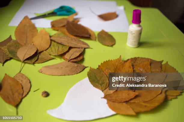 autumn craft with kids. cute hedgehog made of autumn leaves, natural materials. creating process