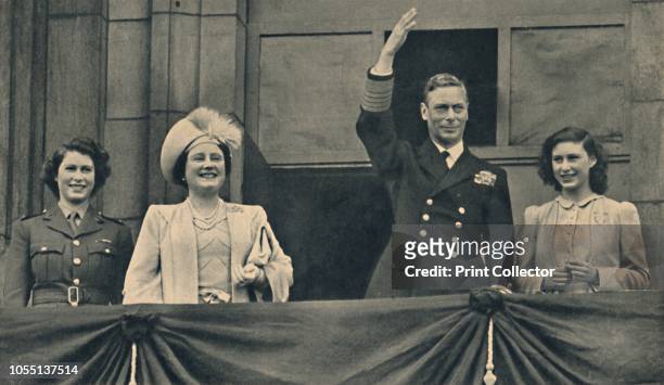 The King and Queen with Princess Elizabeth and Princess Margaret on the Balcony of Buckingham Palace on VE-Day', 8 May 1945. King George VI and Queen...