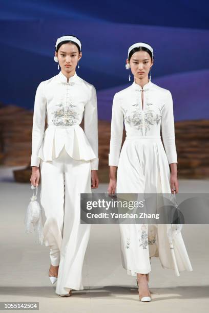 Models showcases designs on the runway at the Heaven Gaia Collection show by designer Xiong Ying during the China Fashion Week Spring/Summer 2019...