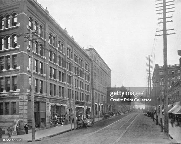 Cherry Street, Seattle, Washington, USA, circa 1900. Telegraph poles and street car tracks. From Scenic Marvels of the New World edited by Prof....