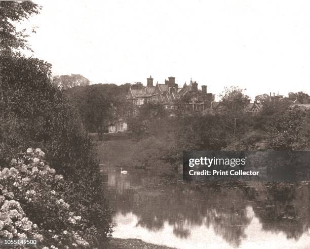 Sandringham House, Norfolk, 1894. View of the royal residence, with ornamental lake in the foreground. From Beautiful Britain; views of our stately...