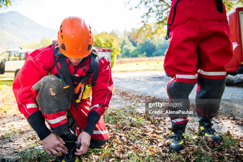 Firefighters In A Dry Suit Preparing For The Rescue Operation By The ...