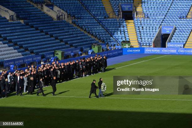 Leicester City vice chairman Aiyawatt "Top" Srivaddhanaprabha and mother Aimon Srivaddhanaprabha lay a wreath during a minute's silence held by...