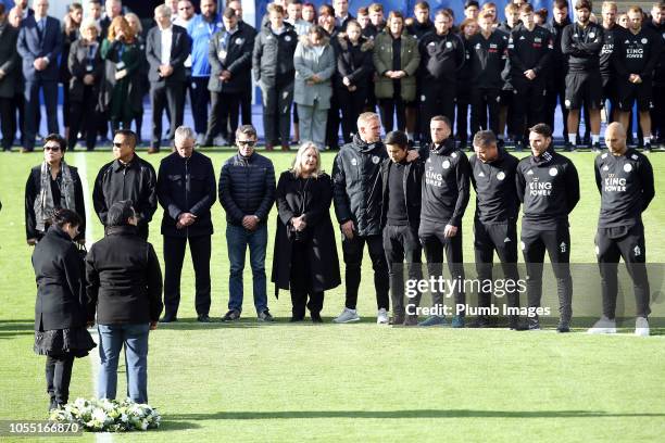 Leicester City vice chairman Aiyawatt "Top" Srivaddhanaprabha and mother Aimon Srivaddhanaprabha lay a wreath during a minute's silence held by...