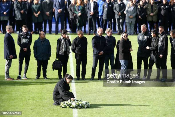 Leicester City vice chairman Aiyawatt "Top" Srivaddhanaprabha and mother Aimon Srivaddhanaprabha lay a wreath during a minute's silence held by...