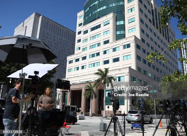 Members of the media work outside the Federal District court for the Southern District of Florida, where Cesar Sayoc will be formally addressed with...