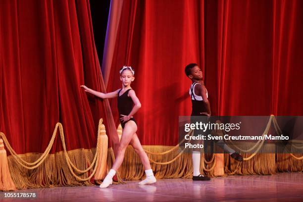 Cuban young ballet students open the curtain during the opening session of the 26th Festival International de Ballet in the Gran Teatro Alicia...