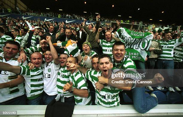 Celtic fans go wild during the Rangers v Celtic match in the Scottish Premier League at Ibrox Stadium, Glasgow. Mandatory Credit: David...