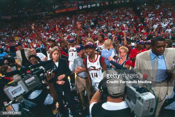 Cynthia Cooper of the Houston Comets celebrates during Game Two of the 2000 WNBA Finals on August 26, 2000 at the Compaq Center in Houston, Texas....