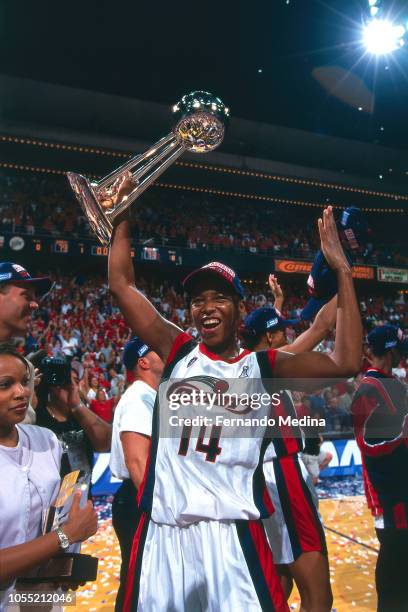 Cynthia Cooper of the Houston Comets celebrates during Game Two of the 2000 WNBA Finals on August 26, 2000 at the Compaq Center in Houston, Texas....