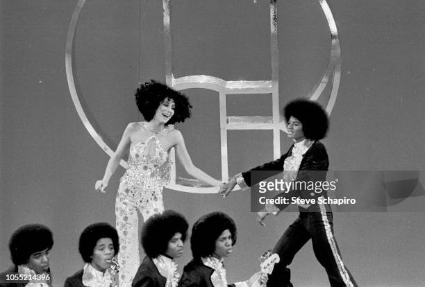 American singers Cher and Michael Jackson , along with members of the Jackson 5, perform on an episode of the former's television variety show...