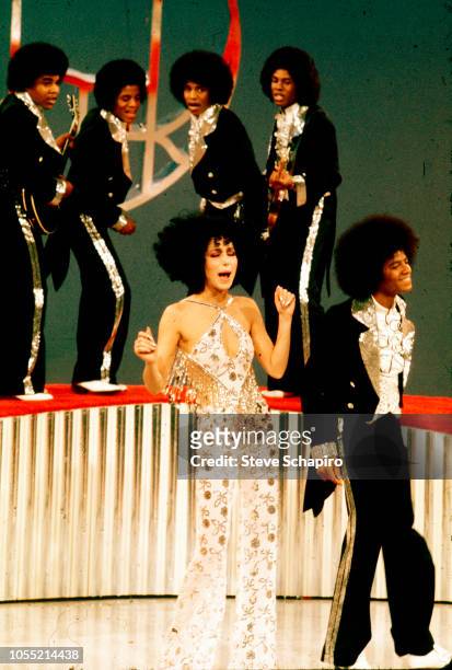 American singers Cher and Michael Jackson , along with members of the Jackson 5, perform on an episode of the former's television variety show...