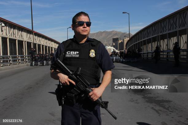 Customs and border patrol agents and riot policemen take part in a border security drill at the US-Mexico international bridge, as seen from Ciudad...
