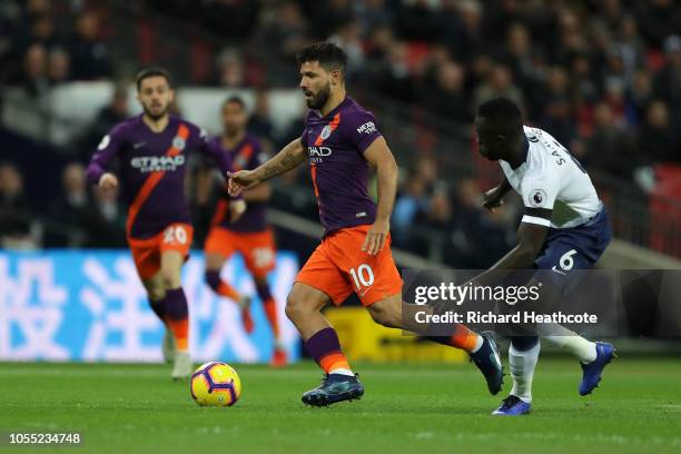 Sergio Aguero of Manchester City is challenged by Davinson Sanchez of Tottenham Hotspur during the Premier League match between Tottenham Hotspur and...