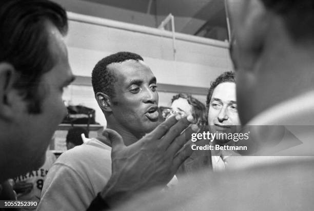 Outstanding star of the 1971 World Series, the Pirates Roberto Clemente looks like a happy man in the Pirates' dressing room after the Pirates became...