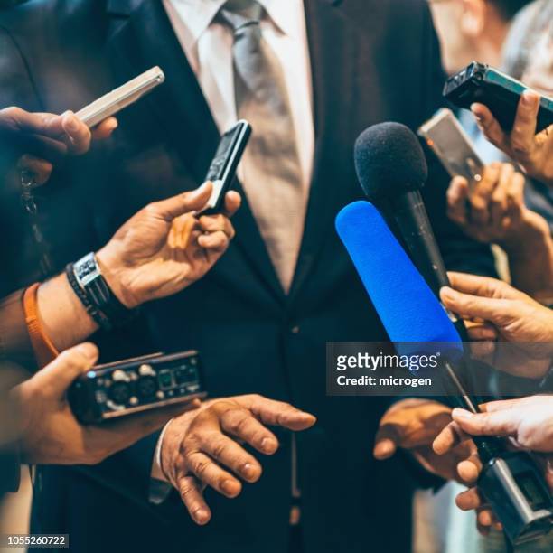 cropped hands holding equipment - journalism stock pictures, royalty-free photos & images