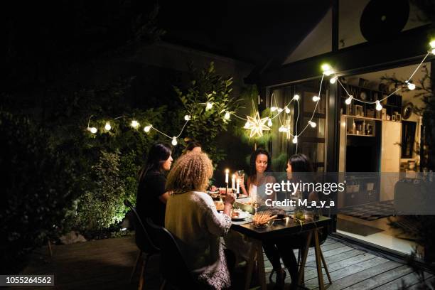 dinner party - garden lighting stock pictures, royalty-free photos & images