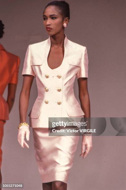 Katoucha Niane walks the runway at the Lapidus Haute Couture Spring/Summer 1990 fashion show during the Paris Fashion Week in January, 1990 in Paris,...