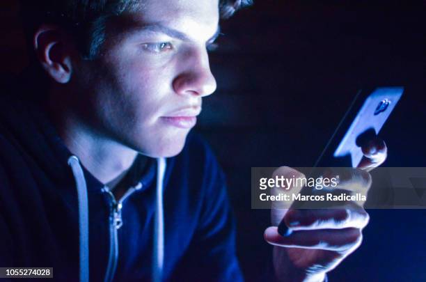 teenager late at night with smartphone - remote location cell phone stock pictures, royalty-free photos & images