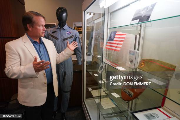 Neil Armstrong's son Mark talks about items that belonged to his father displayed at Heritage Auctions October 2, 2018 in New York. - The items are...