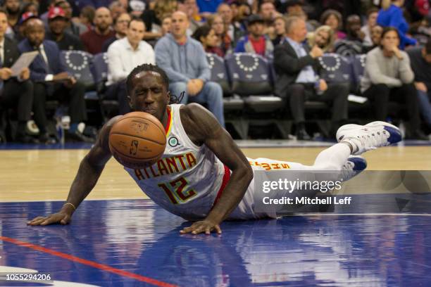 Taurean Prince of the Atlanta Hawks loses control of the ball in the third quarter against the Philadelphia 76ers at the Wells Fargo Center on...