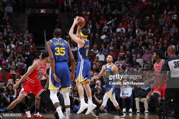 Klay Thompson of the Golden State Warriors shoots his 14th three pointer to break the single game record for the most three's against the Chicago...