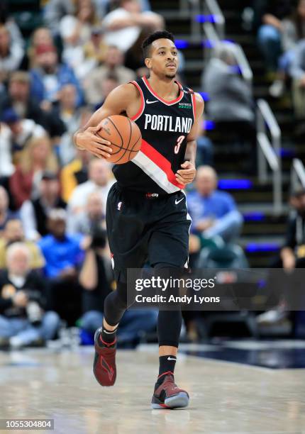 McCollum of the Portland Trailblazers dribbles the ball against the Indiana Pacers at Bankers Life Fieldhouse on October 29, 2018 in Indianapolis,...