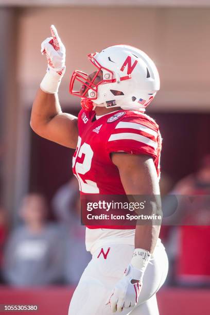 Nebraska Cornhuskers running back Devine Ozigbo signals to his teammates after scoring a touchdown during the game between the Bethune-Cookman...