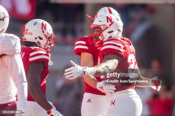 Nebraska Cornhuskers running back Devine Ozigbo celebrates with his teammates after scoring a touchdown during the game between the Bethune-Cookman...