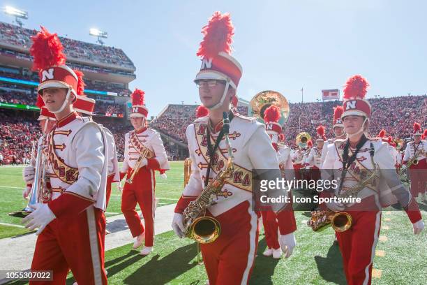 Members of the Corn Husker Marching Band walk to their position on the sidelines during the game between the Bethune-Cookman Wildcats and the...