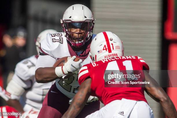 Bethune Cookman Wildcats running back LaDerrien Wilson attempts to navigate a Nebraska defender during the game between the Bethune-Cookman Wildcats...