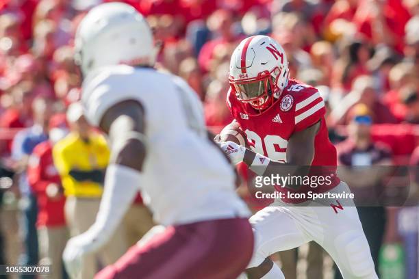 Nebraska Cornhuskers running back Miles Jones stares down a would be defender while bringing the ball upfield during the game between the...