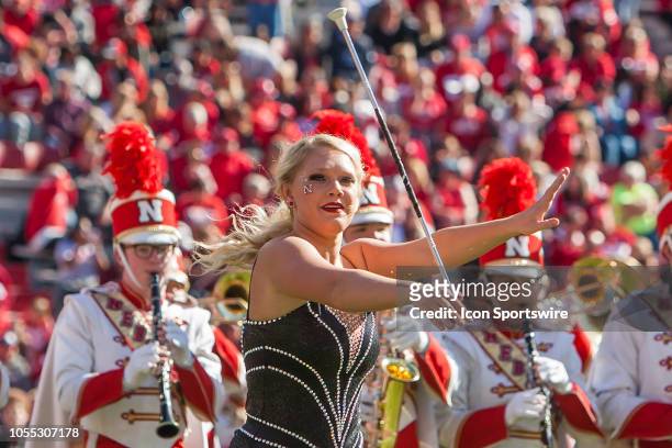 Baton twirler of the Corn Husker Marching Band performs at halftime during the game between the Bethune-Cookman Wildcats and the Nebraska Cornhuskers...