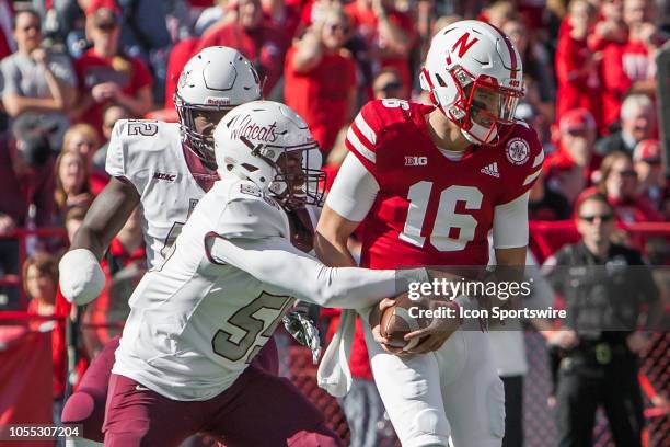 Bethune Cookman Wildcats defensive lineman Todney Evans nearly strips the ball away from Nebraska Cornhuskers quarterback Noah Vedral during the game...