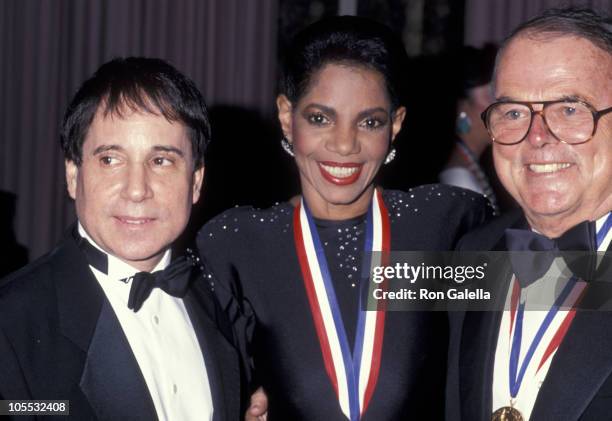 Paul Simon, Melba Moore and Pierre Cossette during Ellis Island Medals of Honor Awards - December 9, 1990 at Waldorf Astoria Hotel in New York City,...