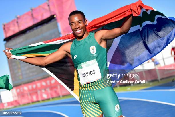 Luke Davids of South Africa celebrates after winning Gold Medal in the Men's 100m Stage 2 heat 5 during day 9 of the Buenos Aires Youth Olympics...