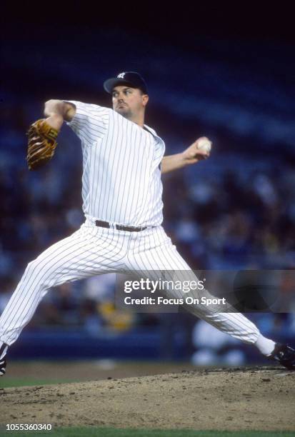 David Wells of the New York Yankees pitches during an Major League Baseball game circa 1997 at Yankee Stadium in the Bronx borough of New York City....