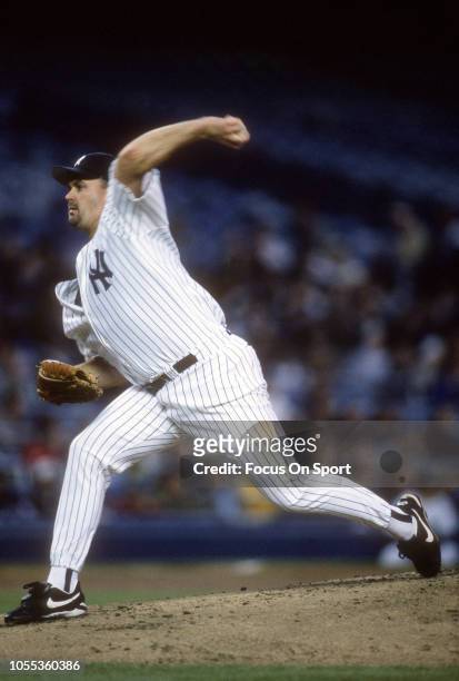 David Wells of the New York Yankees pitches during an Major League Baseball game circa 1997 at Yankee Stadium in the Bronx borough of New York City....