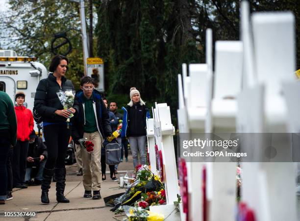 Flowers and stones are placed on the memorials erected outside of the Tree of Life Synagogue in Squirrel Hill. Members of Pittsburgh and the Squirrel...