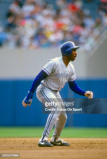 Devon White of the Toronto Blue Jays leads off of second base against the New York Yankees during an Major League Baseball game circa 1991 at Yankee...