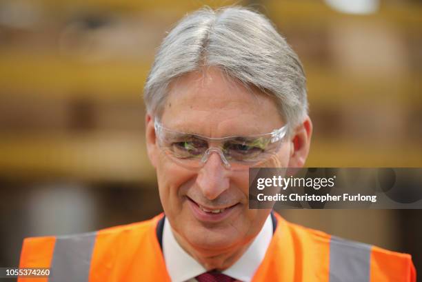 Britain's Chancellor of the Exchequer Philip Hammond tours the Eminox factory, which manufactures high-performance stainless-steel exhaust and...