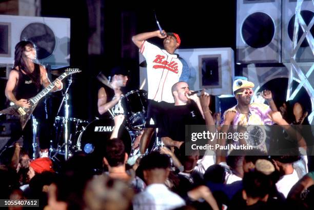 Left to right, Dan Spitz, Charlie Benante, Chuck D, Scott Ian, Flavor Flav, and Frank Bello, from the bands Anthrax and Public Enemy, perform on...