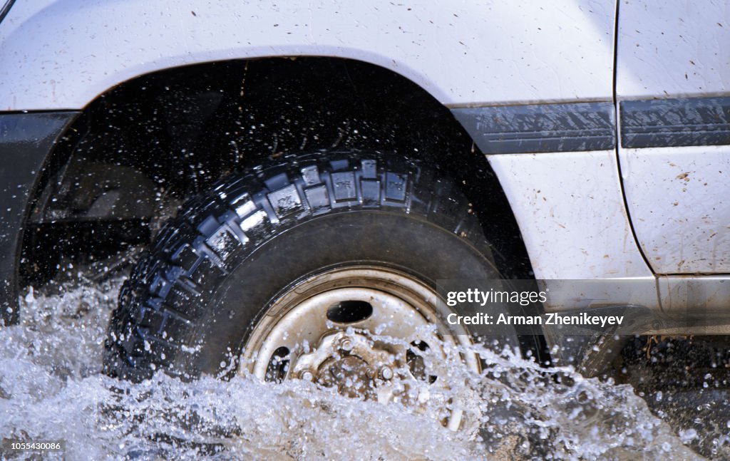 Auto Rivers Mages Offroad Car Driving Through The River Closeup View On The Wheel And ...