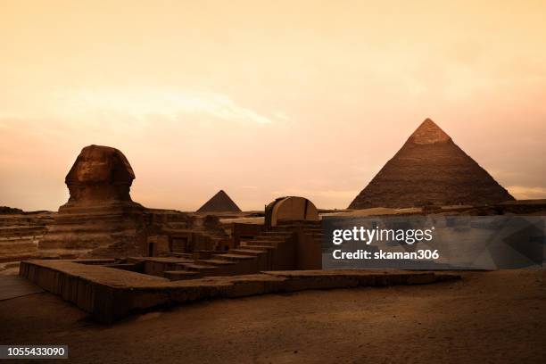 beautiful sunset and ruin the great pyramids of giza (unesco world heritage) near cairo egypt - pyramid of chephren stock pictures, royalty-free photos & images