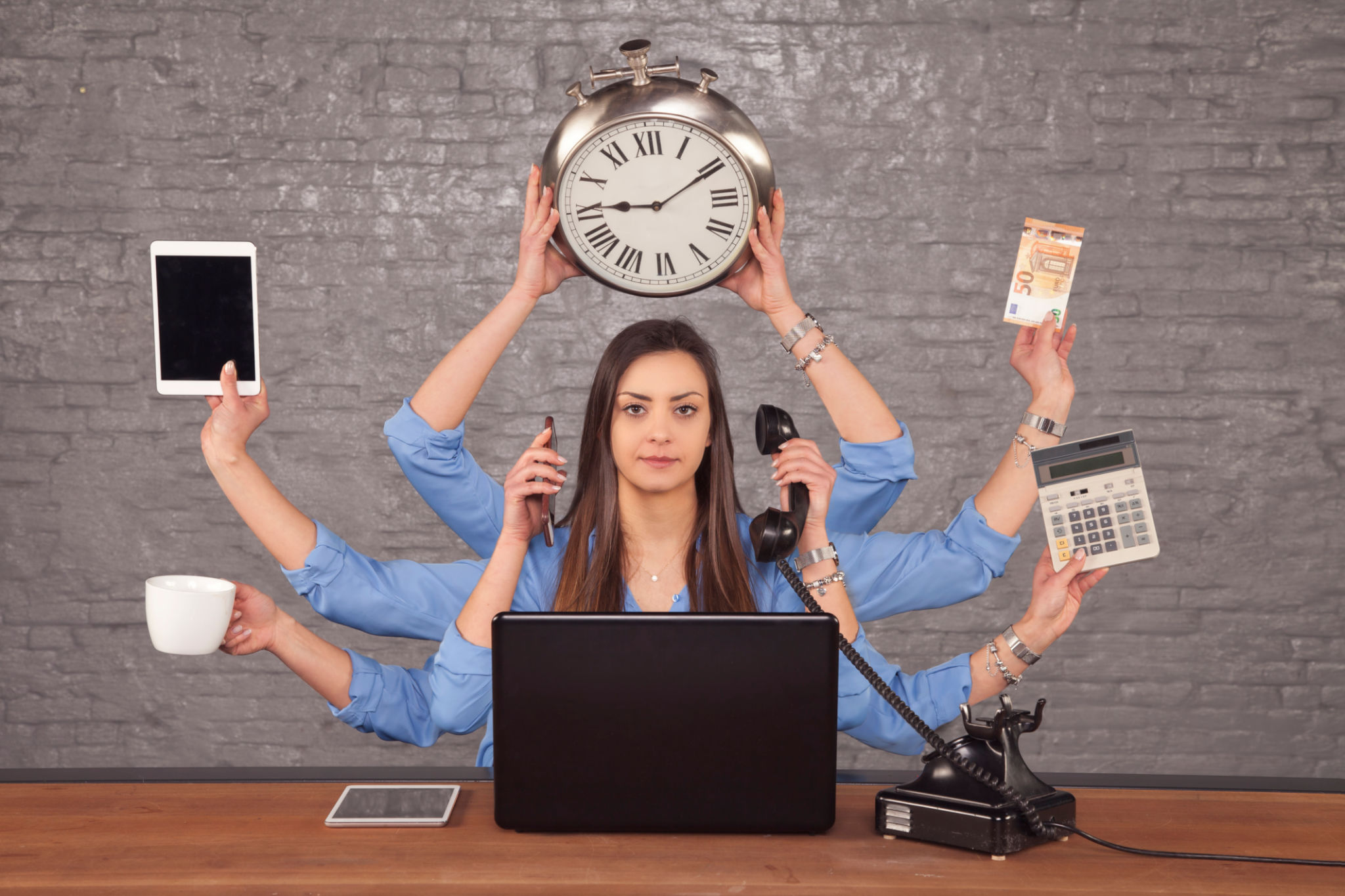 multitask businesswoman sat at the desk in the office, concept of well organized work multitask businesswoman sat at the desk in the office, concept of well organized work