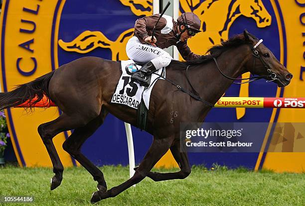 Jockey Chris Munce rides Descarado to win race 8 the BMW Caulfield Cup during Caulfield Cup Day at Caulfield Racecourse on October 16, 2010 in...