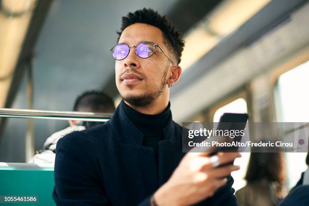 thoughtful businessman with smartphone - 乗り物内部 ストックフォトと画像