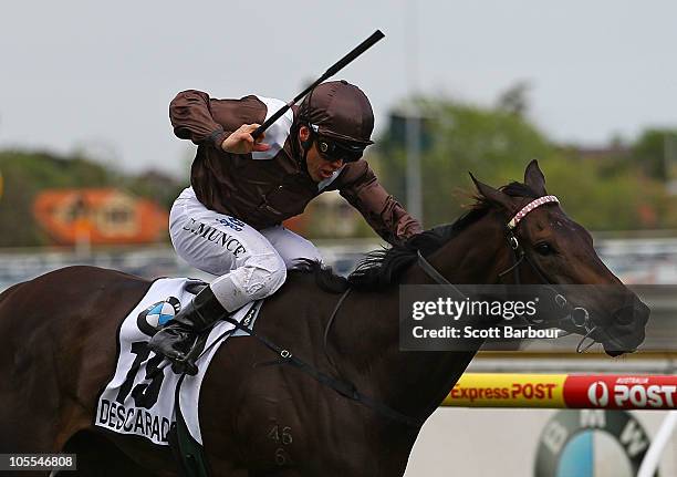 Jockey Chris Munce rides Descarado to win race 8 the BMW Caulfield Cup during Caulfield Cup Day at Caulfield Racecourse on October 16, 2010 in...